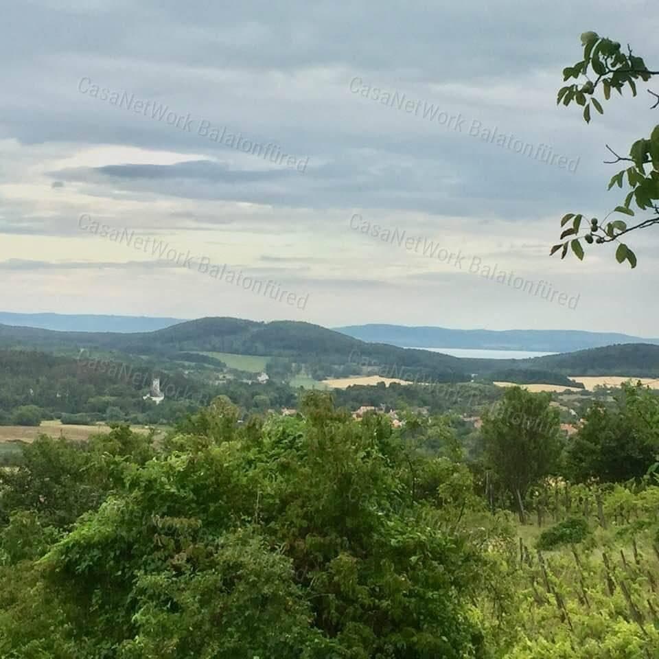 Garden plot with partial views over Pécselyi basin and Lake Balaton, with wine cellar and press house